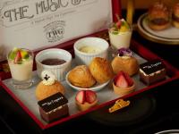 a tray of pastries and desserts on a table at Hotel de l'Opera Hanoi - MGallery in Hanoi