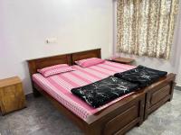 Srishti Homestayにあるベッド