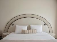 A bed or beds in a room at Atlantica Thalassa Hotel