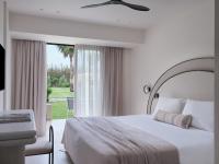 A bed or beds in a room at Atlantica Thalassa Hotel