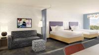 Una habitación de hotel con cama y sofá en Home2 Suites By Hilton Owensboro, en Owensboro