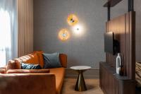 Televízia a/alebo spoločenská miestnosť v ubytovaní Lavoo Boutique Apartments