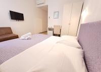 Posteľ alebo postele v izbe v ubytovaní Medulić Palace Rooms & Apartments
