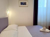 Posteľ alebo postele v izbe v ubytovaní Medulić Palace Rooms & Apartments