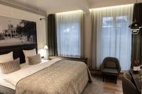Postel nebo postele na pokoji v ubytování Ascot Hotel