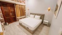 A bed or beds in a room at L'Agora Old Town Hotel & Bazaar