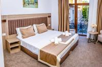 Postel nebo postele na pokoji v ubytování Evelin Deluxe House