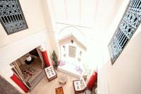 an overhead view of a living room with a fireplace at Riad Chorfa in Marrakesh