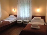 Łóżko lub łóżka w pokoju w obiekcie Jókai Apartmanház