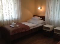 Łóżko lub łóżka w pokoju w obiekcie Jókai Apartmanház