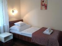 Łóżko lub łóżka w pokoju w obiekcie Jókai Apartmanház