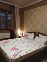 A bed or beds in a room at The Pearl Apartment Varna