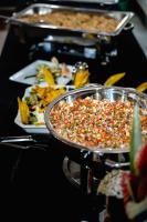 een tafel met verschillende dienbladen eten op een tafel bij Hill Garden Resort Hotel in San Ignacio