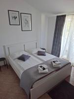 Postel nebo postele na pokoji v ubytování Martina Guest house