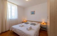 Posteľ alebo postele v izbe v ubytovaní Apartments Tamarix