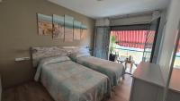 A bed or beds in a room at Atico Terraza, Airport-BCN, Puerto-Cruceros
