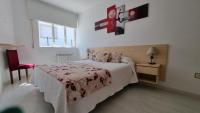 Postel nebo postele na pokoji v ubytování Apartamento Playa De Lariño