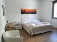 A bed or beds in a room at Passi Alterni Apartments