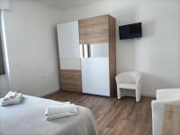 A bed or beds in a room at Passi Alterni Apartments
