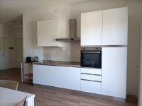 A kitchen or kitchenette at Passi Alterni Apartments