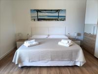 A bed or beds in a room at Passi Alterni Apartments