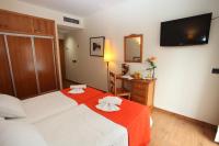 Postel nebo postele na pokoji v ubytování Hotel La Bodega