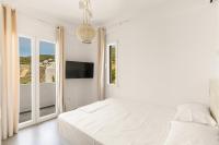 Posteľ alebo postele v izbe v ubytovaní White Villas Paros