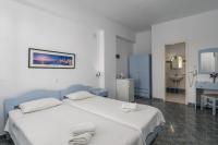 Posteľ alebo postele v izbe v ubytovaní Apollon Rooms