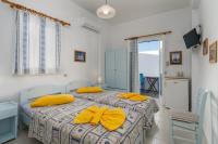 Posteľ alebo postele v izbe v ubytovaní Apollon Rooms