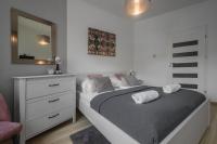 Posteľ alebo postele v izbe v ubytovaní Apartamenty City Center - Zdrojowe
