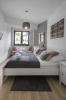Posteľ alebo postele v izbe v ubytovaní Apartamenty City Center - Zdrojowe
