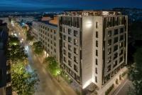 an overhead view of a white building at night at Academias Hotel, Autograph Collection in Athens