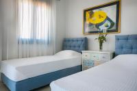 Postel nebo postele na pokoji v ubytování Seirios Luxury Villa