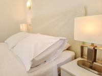 Posteľ alebo postele v izbe v ubytovaní Medulić Palace Rooms & Apartments