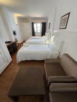 Postel nebo postele na pokoji v ubytování Hotel Las Camelias