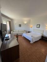 Postel nebo postele na pokoji v ubytování Hotel Las Camelias