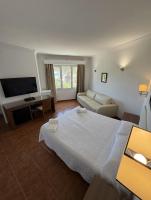 Postel nebo postele na pokoji v ubytování Hotel Las Camelias