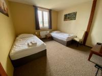 Postel nebo postele na pokoji v ubytování Valnovka Wellness Hotel