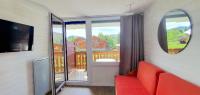 Telewizja i/lub zestaw kina domowego w obiekcie Pieds des pistes - Parking couvert - Plein sud