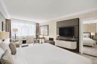 A bed or beds in a room at Kempinski Hotel Corvinus Budapest
