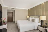 A bed or beds in a room at Kempinski Hotel Corvinus Budapest