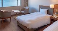 Imazu Sun Bridge Hotelにあるベッド