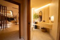a bathroom with a sink and a mirror on the wall at Hotel Boutique MANANTIAL DE CELA in Tíjola