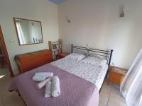 Posteľ alebo postele v izbe v ubytovaní The Vrachos Beach House