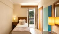Posteľ alebo postele v izbe v ubytovaní Mitsis Alexander the Great Hotel