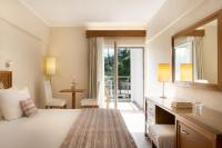 Posteľ alebo postele v izbe v ubytovaní Mitsis Alexander the Great Hotel