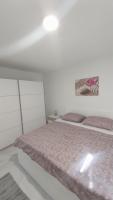 Posteľ alebo postele v izbe v ubytovaní Apartmani Miletić