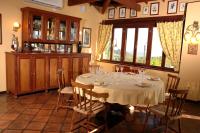 a dining room with a table and chairs and a window at Visconte Ditalia Hotel e Eventos - Próximo a Gramado in Nova Hartz