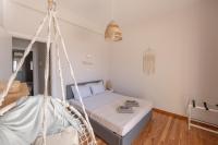 Postel nebo postele na pokoji v ubytování Onar Beachfront Residence, Loutraki