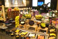 a buffet with many different types of food on display at Ramada Encore by Wyndham Chandigarh Zirakpur in Zirakpur